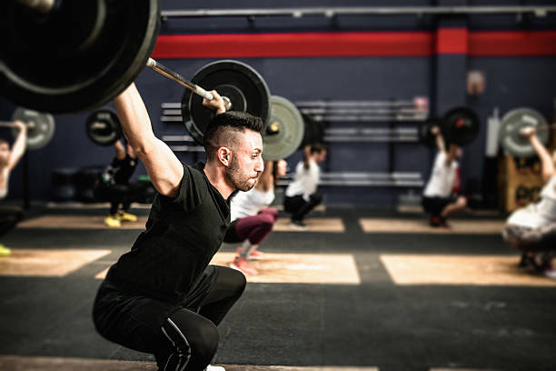 istock strong man weightlifting a barbell 638803172