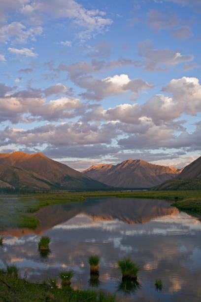 istock Mountains in sunset light and reflections in the lake. 638803190