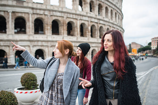 istock friends woman walking embraced in rome 638803358