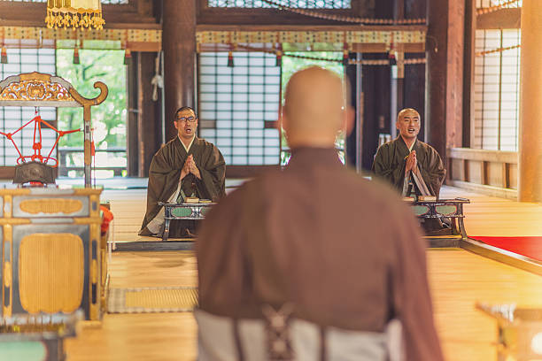 istock Monks during prayer in Buddhist shrine in Kyoto 638805400