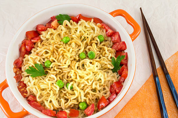 istock noodles with tomato and peas in a bowl 638805496