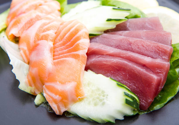 istock tuna and salmon sashimi on black dish 638806144