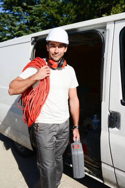 istock young electrician worker taking tools out of professional truck van 638807732