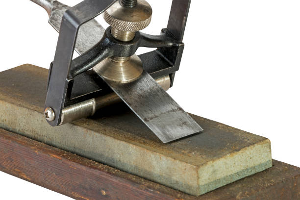 istock Chisel Clamped in Angle Guide Jigs on Grinding Whetstones 638810584