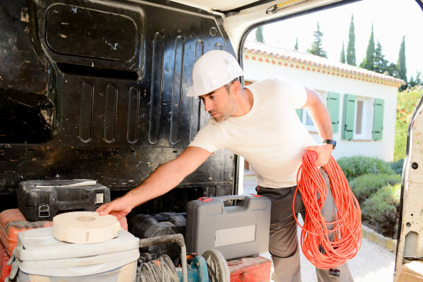 istock young electrician worker taking tools out of professional truck van 638812468