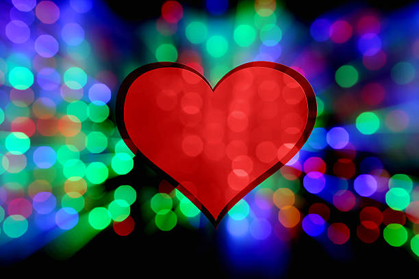 istock Red heart on a colorful defocused lights background 638813682