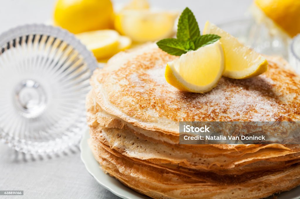 Pancakes English-style pancakes with lemon and sugar, traditional for Shrove Tuesday Pancake Stock Photo