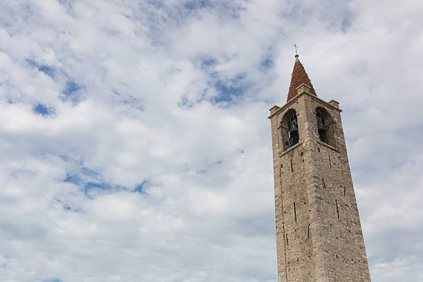 istock Church tower on front of sky with clouds 638815064