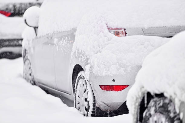 istock Snow covered cars during snowfall 638816508