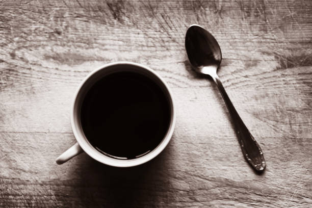 istock Horizontal cup with spoon bokeh sepia background 638817986