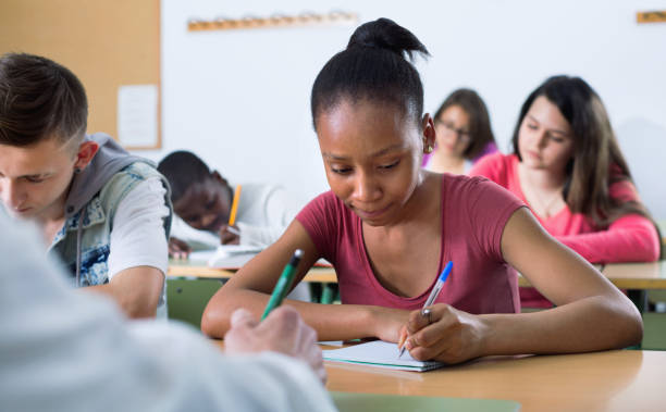 istock Enthusiastic girls and boys taking the notes while 638819014