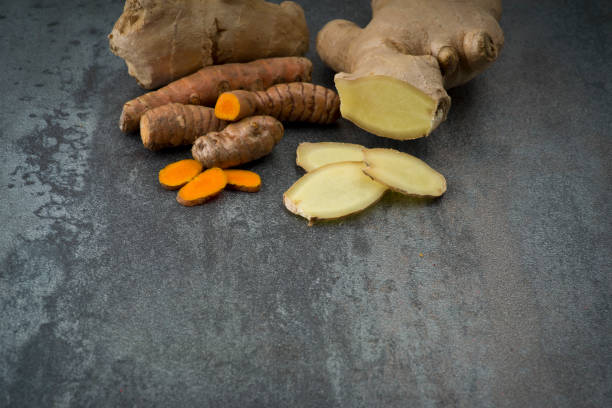 istock turmeric slices and ginger root sliced 638821524