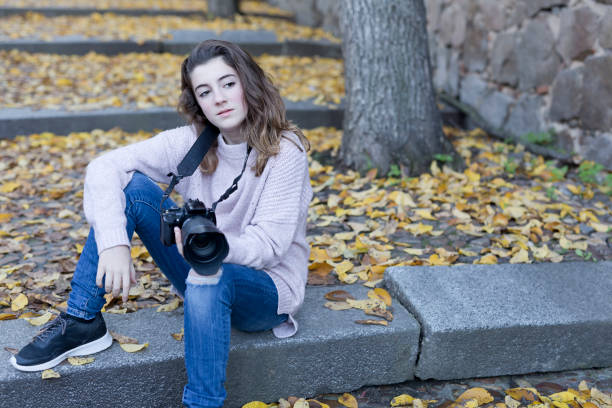 istock Young woman taking photos 638823252