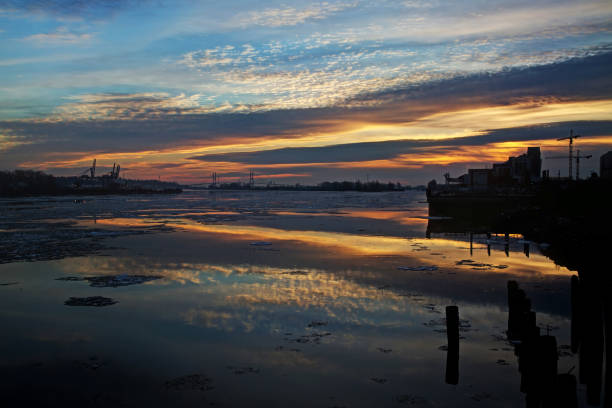 istock city at riverside with evening glow 638823334