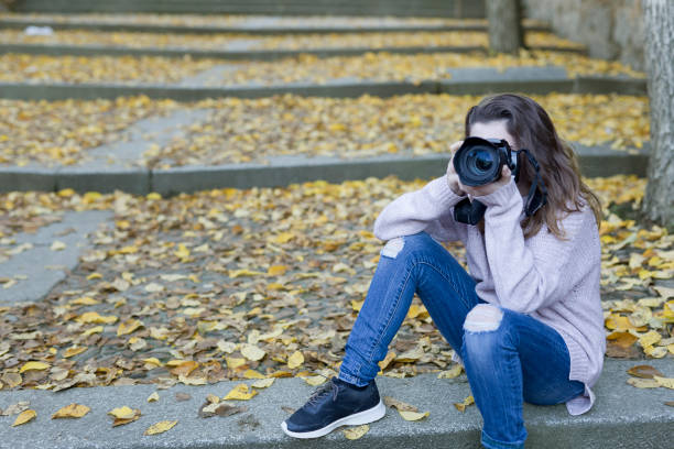 istock Young woman taking photos 638823340