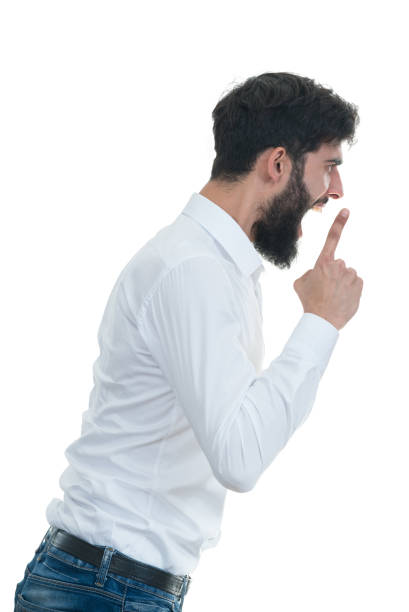 istock sideview of young man with open mouth. 638826330