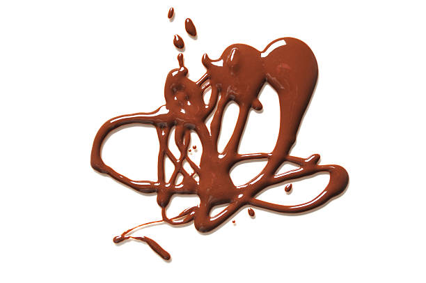 istock Melted Chocolate on a Sheet of Plexiglas Creating a Design 638829396