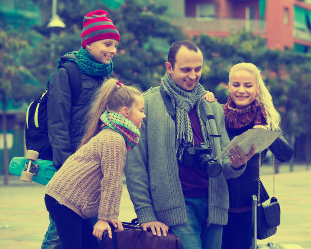 istock Family  reading city map 638830136