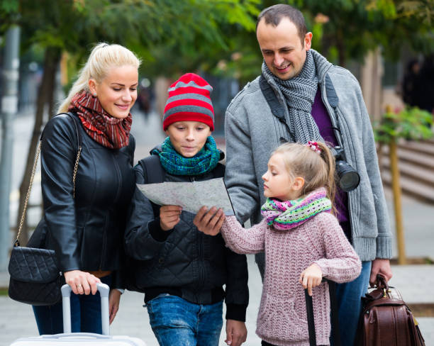 istock Family reading city map 638831914