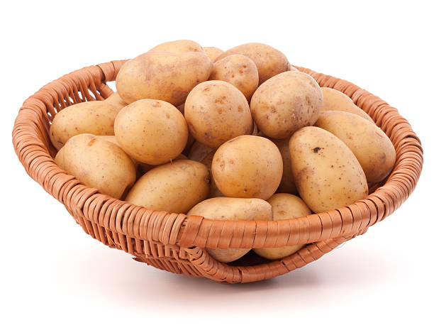 istock Potato tuber  in wicker basket isolated on white background 638833372