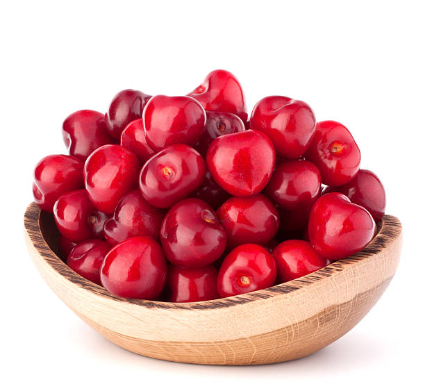 istock cherry berries in wooden bowl 638834130