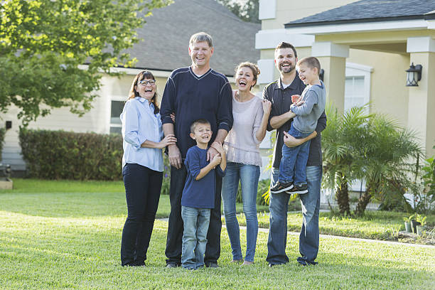 istock Multi-generation family portrait outside house 638834576