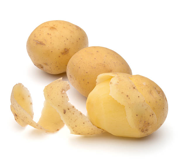 istock peeled potato tuber with peel spiral isolated on white backgroun 638837242
