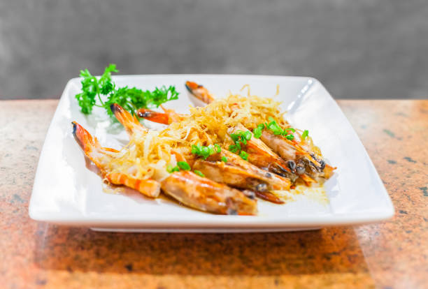 istock asian seafood fried prawn with garlic 638839098