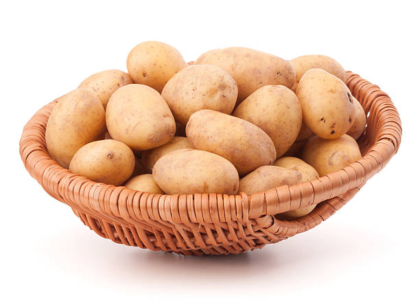 istock Potato tuber  in wicker basket isolated on white background 638839252