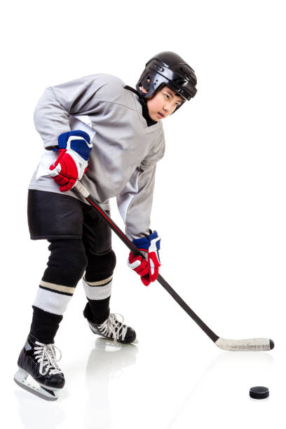 istock Junior Ice Hockey Player Isolated on White Background 638840448