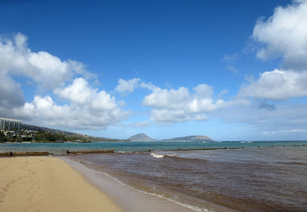 istock wall runs into the water at Kahala Beach 638840496
