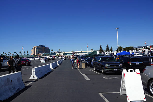People Walking And Tailgate In Parking Lot Before Stock Photo - Download  Image Now - California, Parking Lot, Stadium - iStock