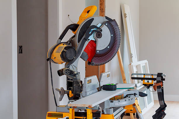 istock Carpenter workplace Man using circular saw to cut wood 638845024