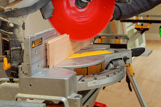 istock Carpenter workplace Man using circular saw to cut wood 638845042