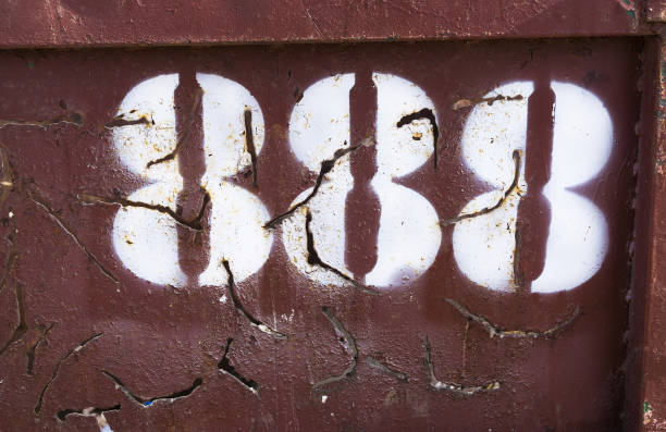 istock Horizontal vintage cyberpunk number 888 on rusty container backd 638845192