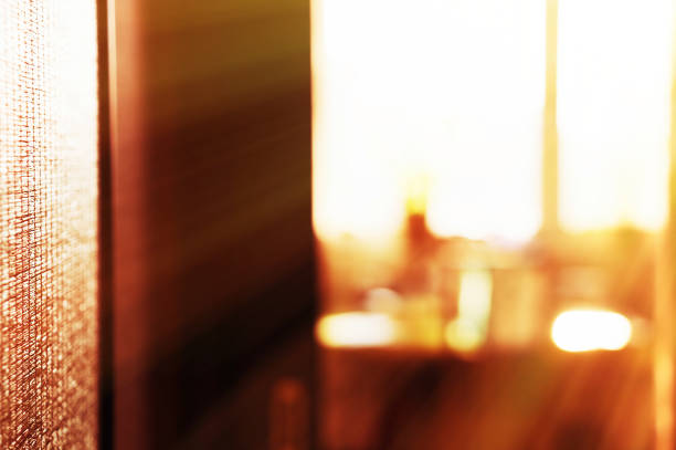 istock Horizontal room with evening ray of light bokeh background 638849748