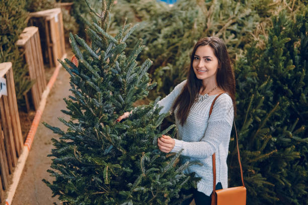 istock girl and Christmas tree 638852956