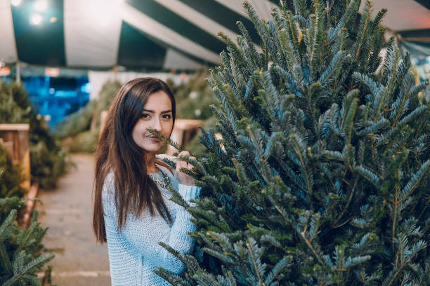 istock girl and Christmas tree 638853030