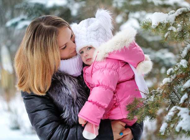istock Mother and daughter hug. Winter fun. 638855784