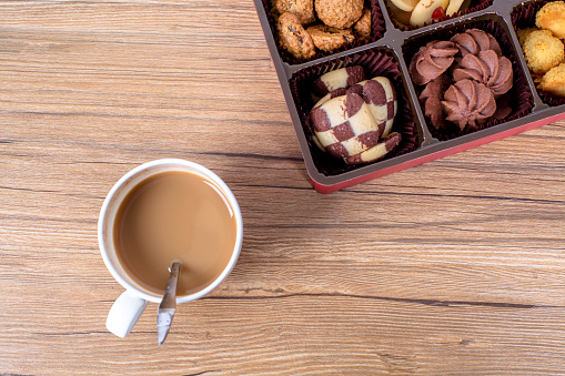Coffee and cookies and mokapot on tray on wooden table. Copyspace for your text