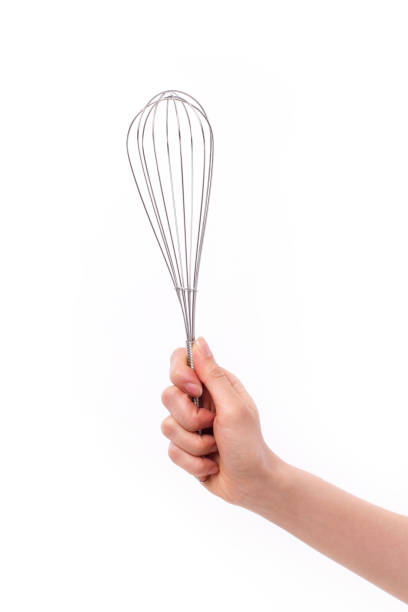 istock baker or chef hand holding whisker, kitchen utensil 638856376