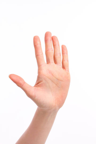 istock woman hand showing stop or halt gesture hand sign 638856528