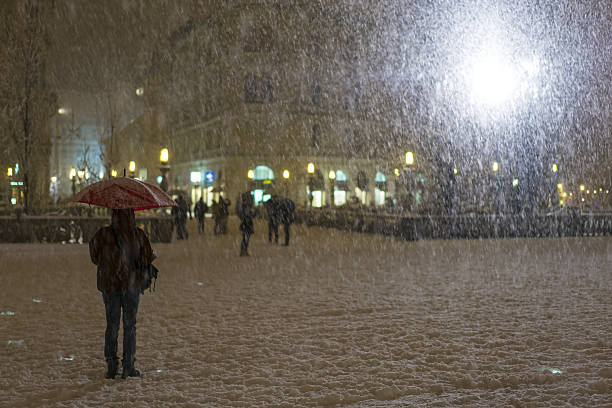 istock Umbrella and Snow falling on Presern Square in Slovenia. 638860872