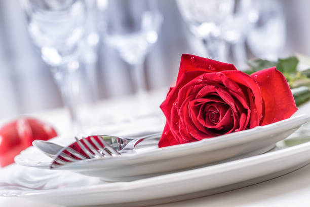 istock Table setting for valentines or wedding day with red roses. 638860888