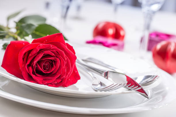 istock Table setting for valentines or wedding day with red roses. 638861076