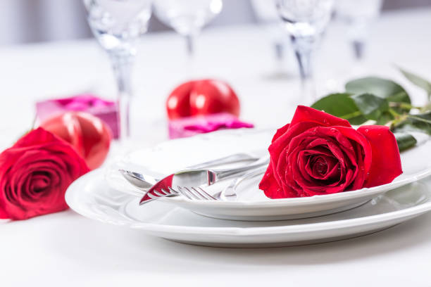 istock Table setting for valentines or wedding day with red roses. 638861104