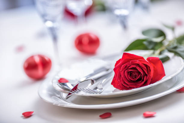istock Table setting for valentines or wedding day with red roses. 638861170