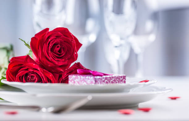 istock Table setting for valentines or wedding day with red roses. 638861388