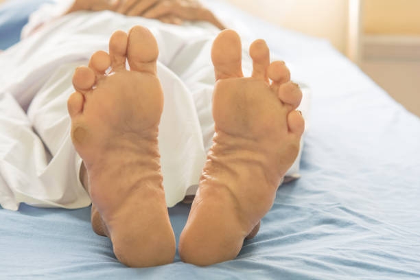 istock old foot women on bed patient 638863614