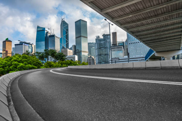 Professional use auto advertising backplate empty asphalt road with central district of Hong Kong on background,China. overpass road stock pictures, royalty-free photos & images